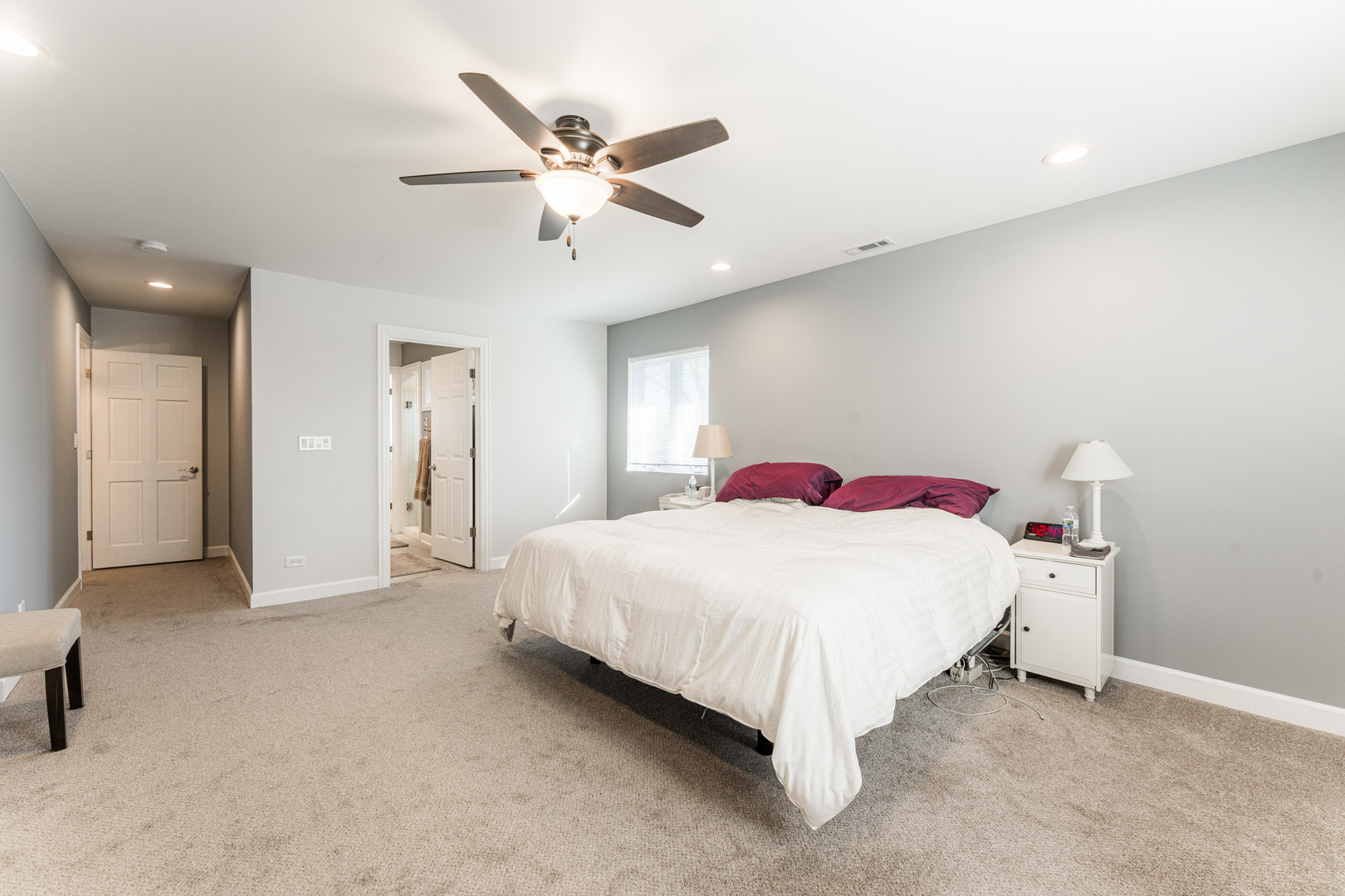 181 North Prince Crossing Road West Chicago, IL 60185 - Photo 27 of 62 a bedroom with a bed and a chandelier