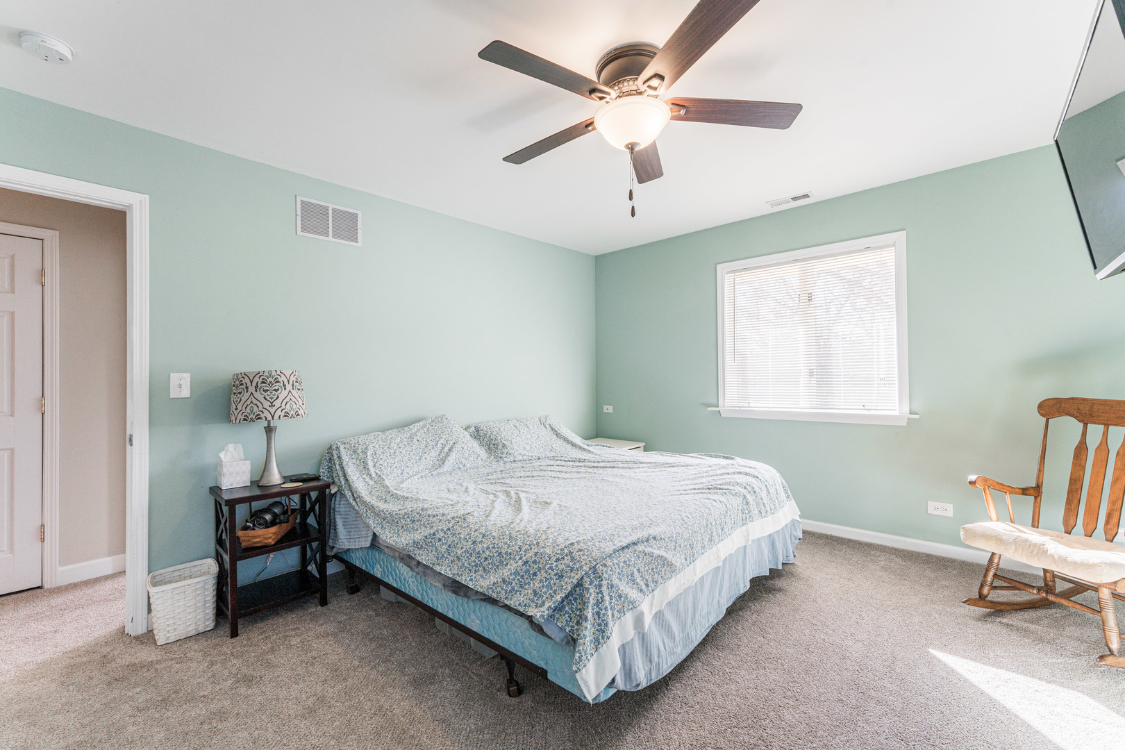 181 North Prince Crossing Road West Chicago, IL 60185 - Photo 33 of 62 a bedroom with a bed a chair and a window