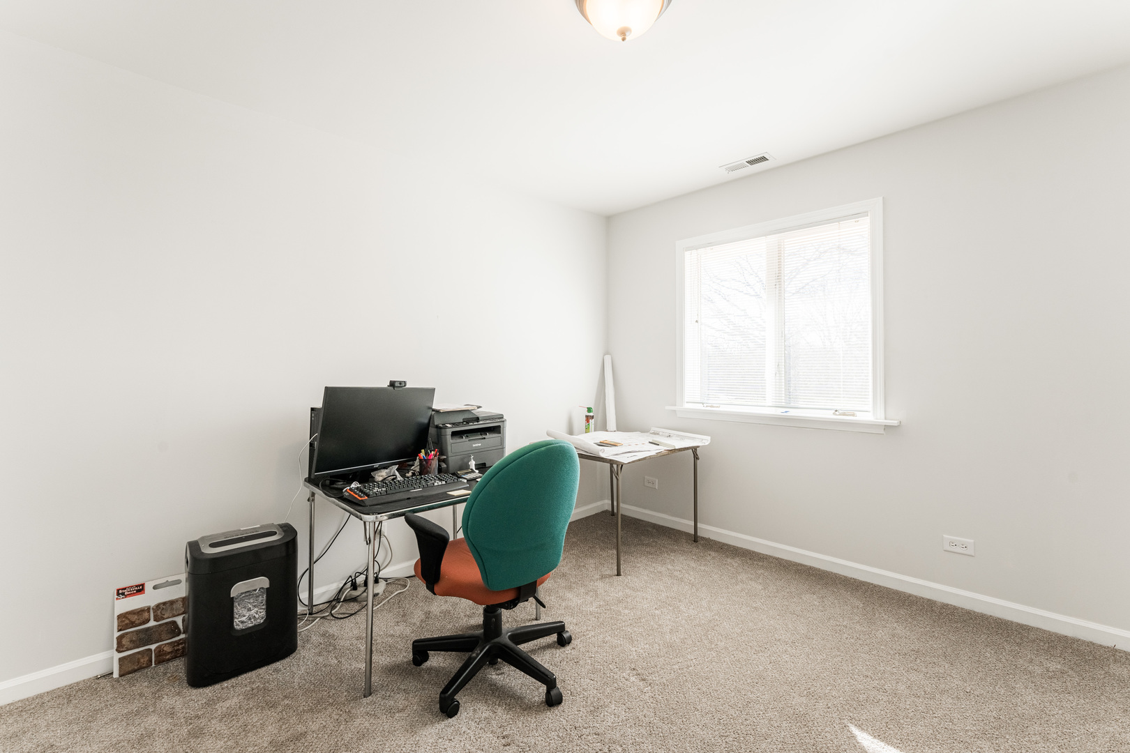 181 North Prince Crossing Road West Chicago, IL 60185 - Photo 34 of 62 a view of a workspace with furniture and a window