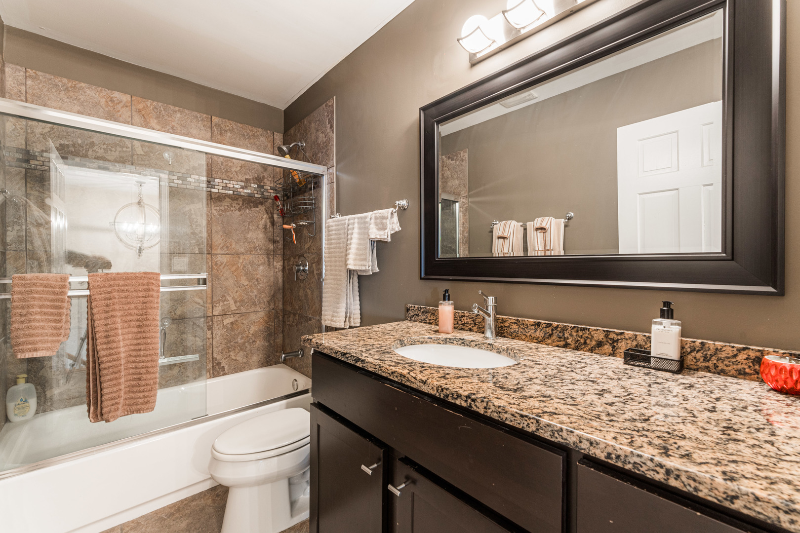 181 North Prince Crossing Road West Chicago, IL 60185 - Photo 35 of 62 a bathroom with a granite countertop sink toilet a mirror and shower