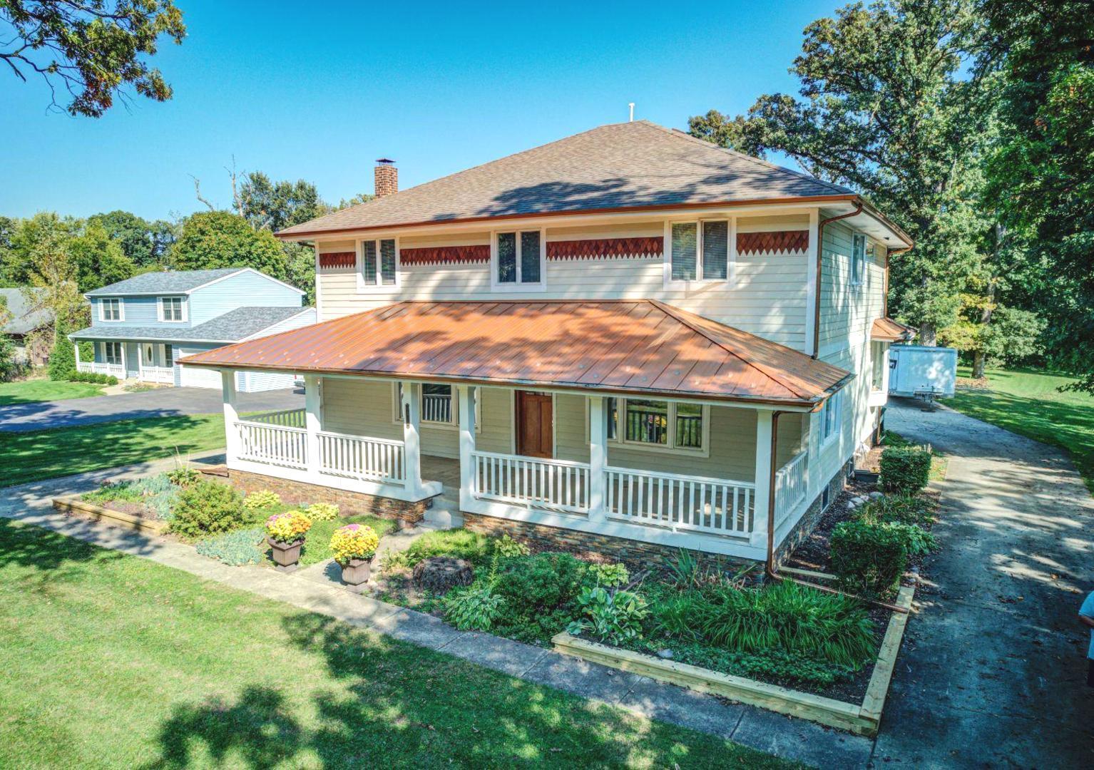 181 North Prince Crossing Road West Chicago, IL 60185 - Photo 4 of 62 a front view of a house with a yard