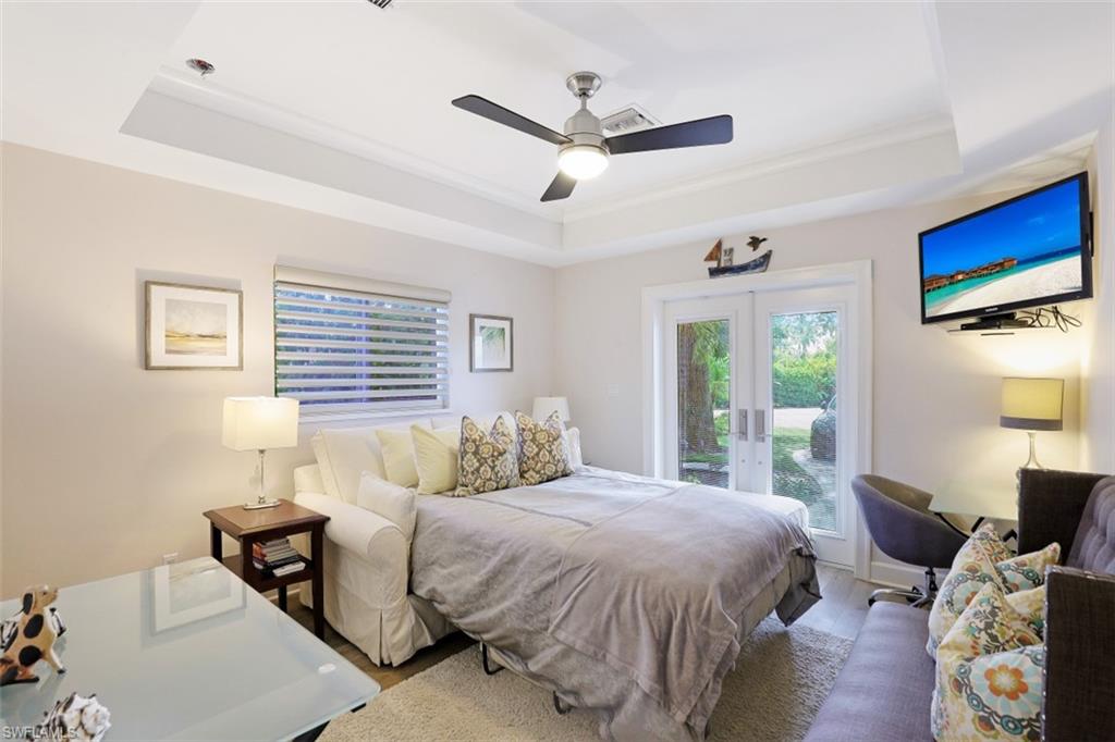 1199 9th Avenue North Naples, FL 34102 - Photo 17 of 24 a bedroom with a bed and a window