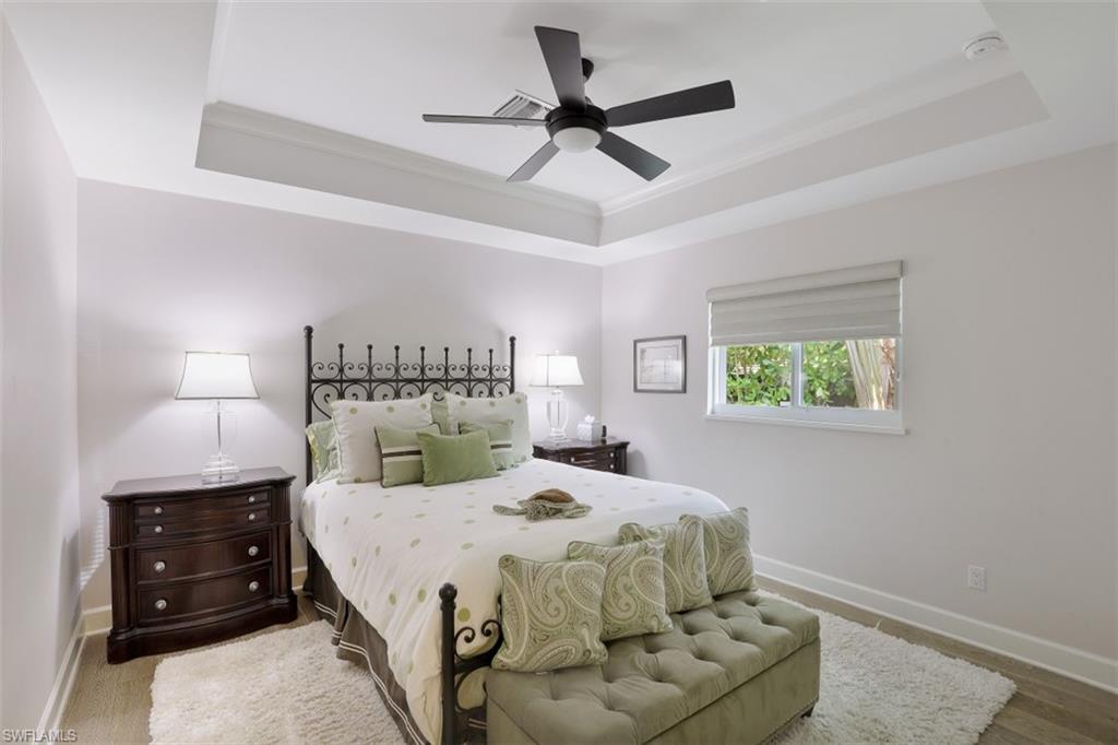1199 9th Avenue North Naples, FL 34102 - Photo 19 of 24 a bedroom with a bed and window