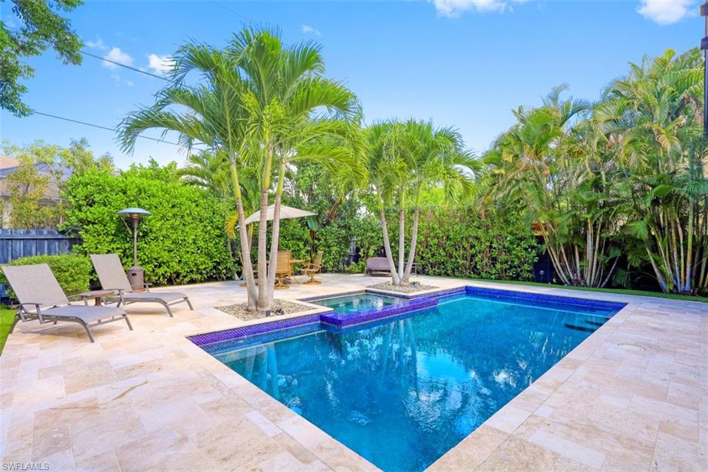 1199 9th Avenue North Naples, FL 34102 - Photo 20 of 24 a view of swimming pool with chairs