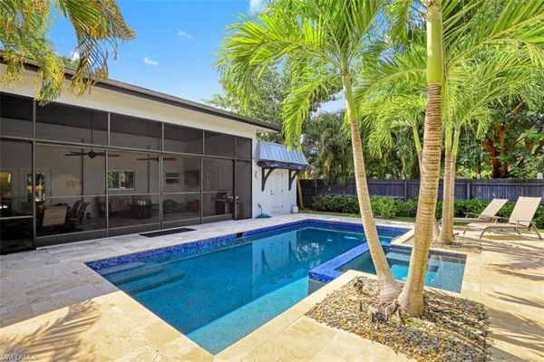 a view of swimming pool with chairs