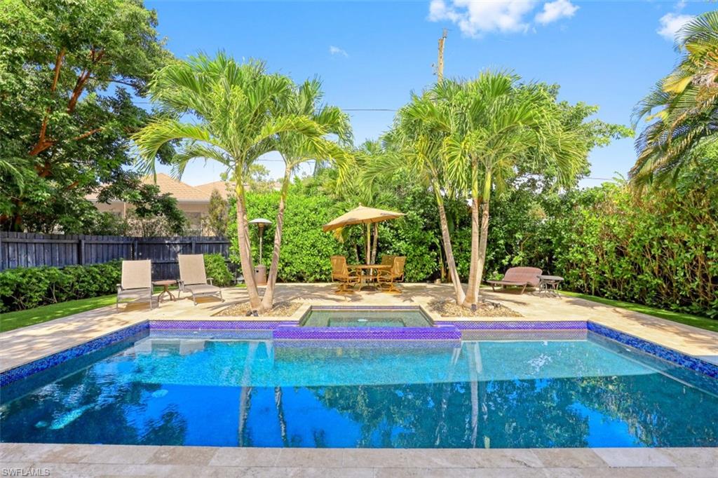 1199 9th Avenue North Naples, FL 34102 - Photo 22 of 24 a view of backyard with wooden fence