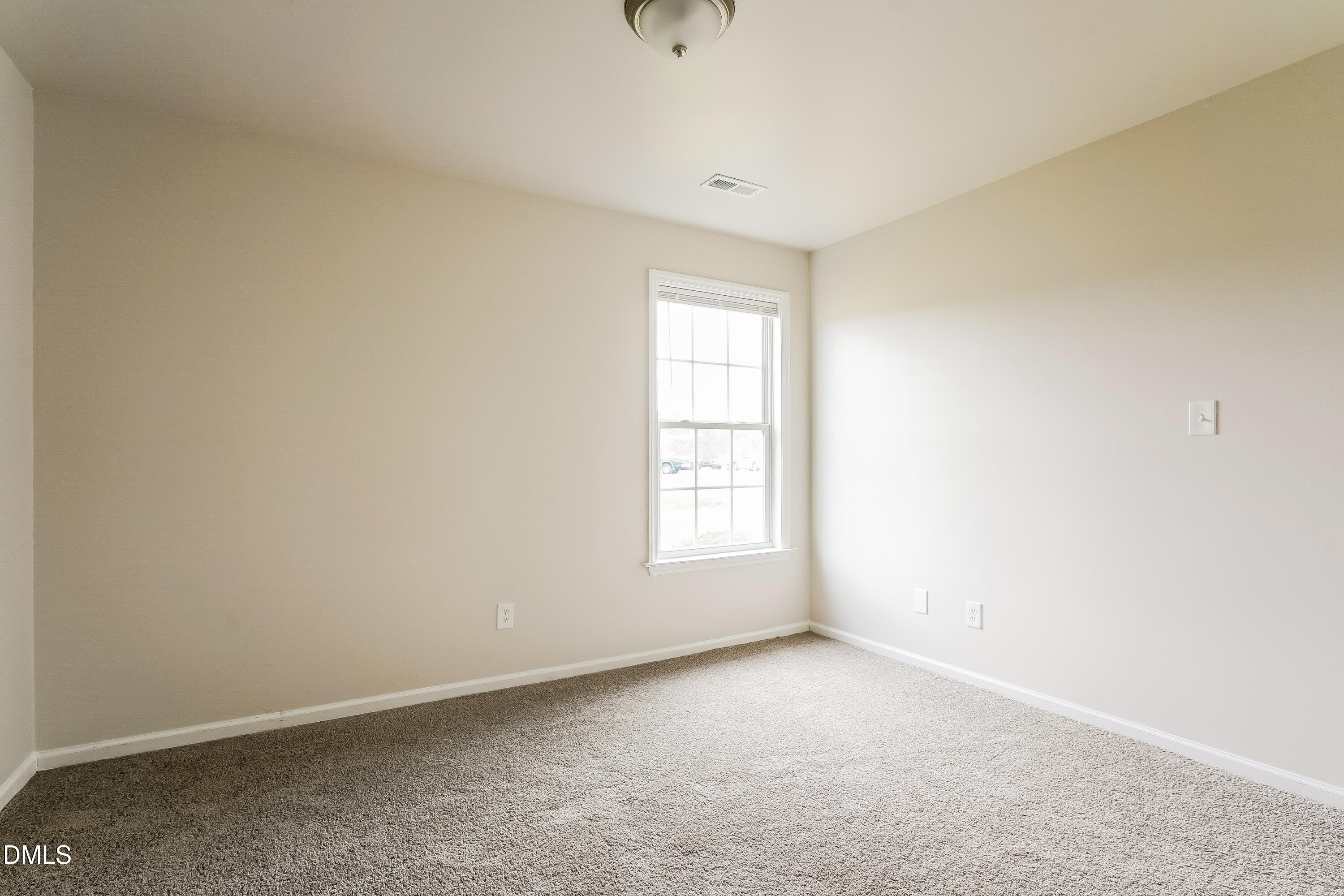 99 Jethro Circle Smithfield, NC 27577 - Photo 12 of 16 an empty room with windows