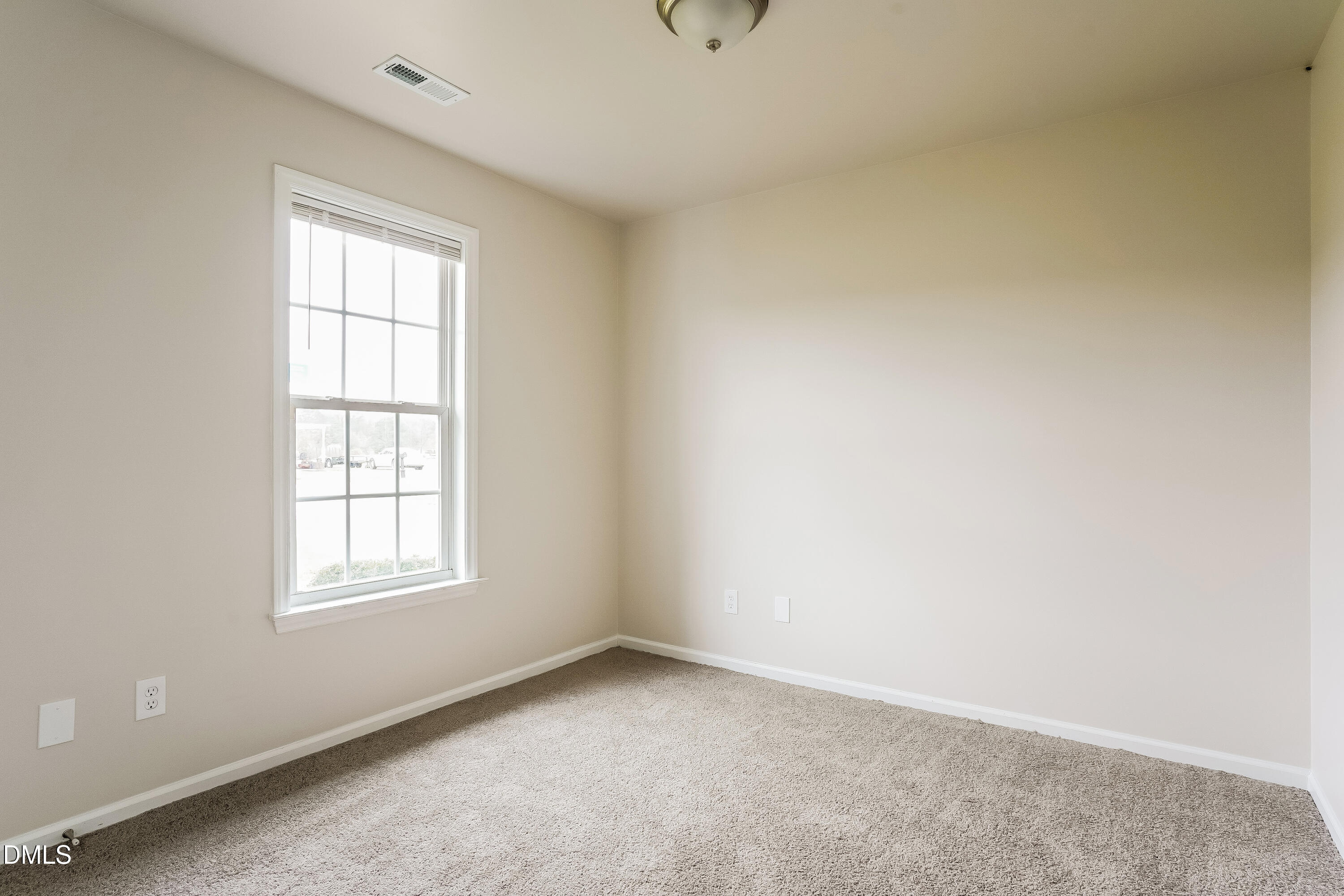 99 Jethro Circle Smithfield, NC 27577 - Photo 13 of 16 an empty room with windows
