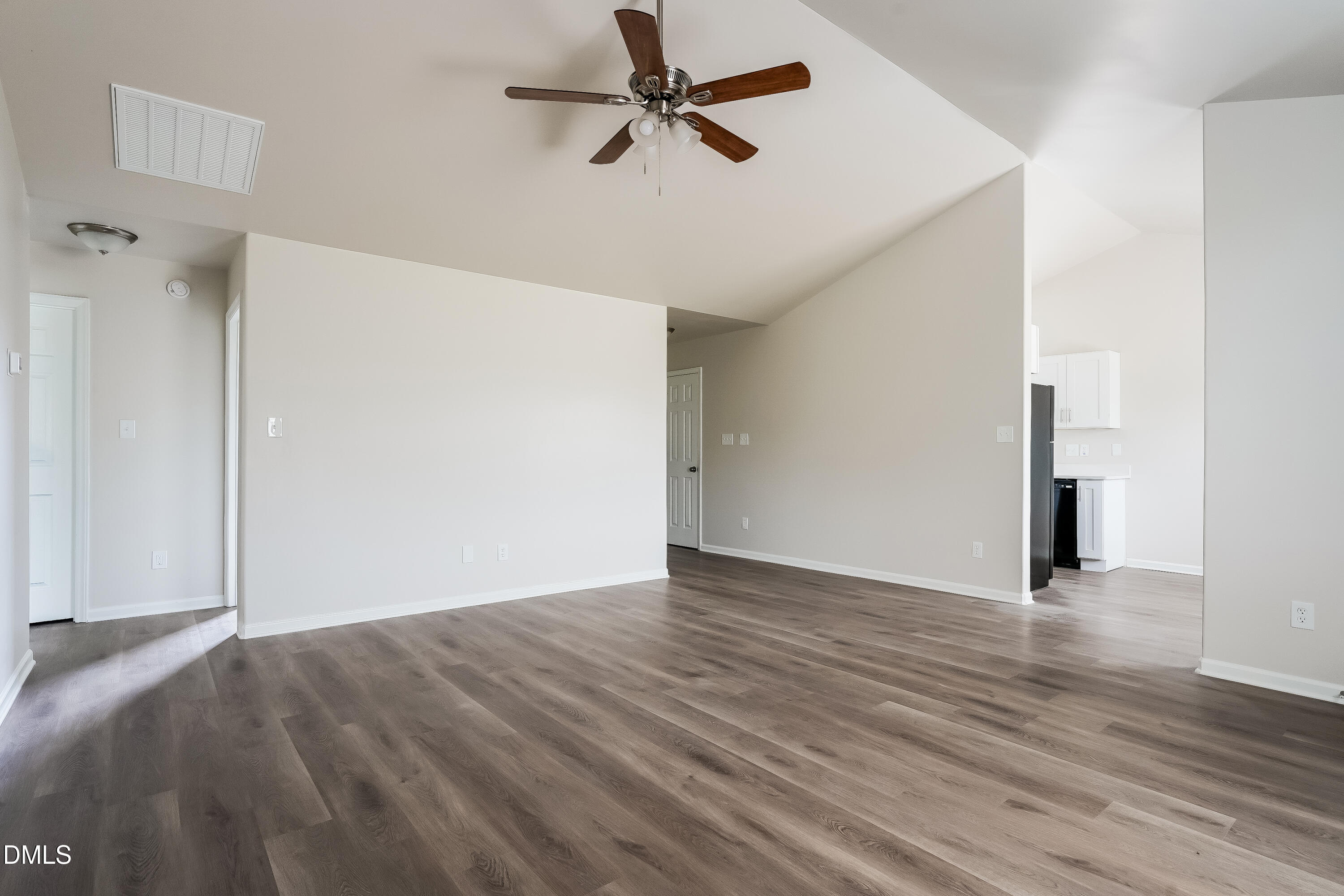 99 Jethro Circle Smithfield, NC 27577 - Photo 4 of 16 a view of empty room with wooden floor