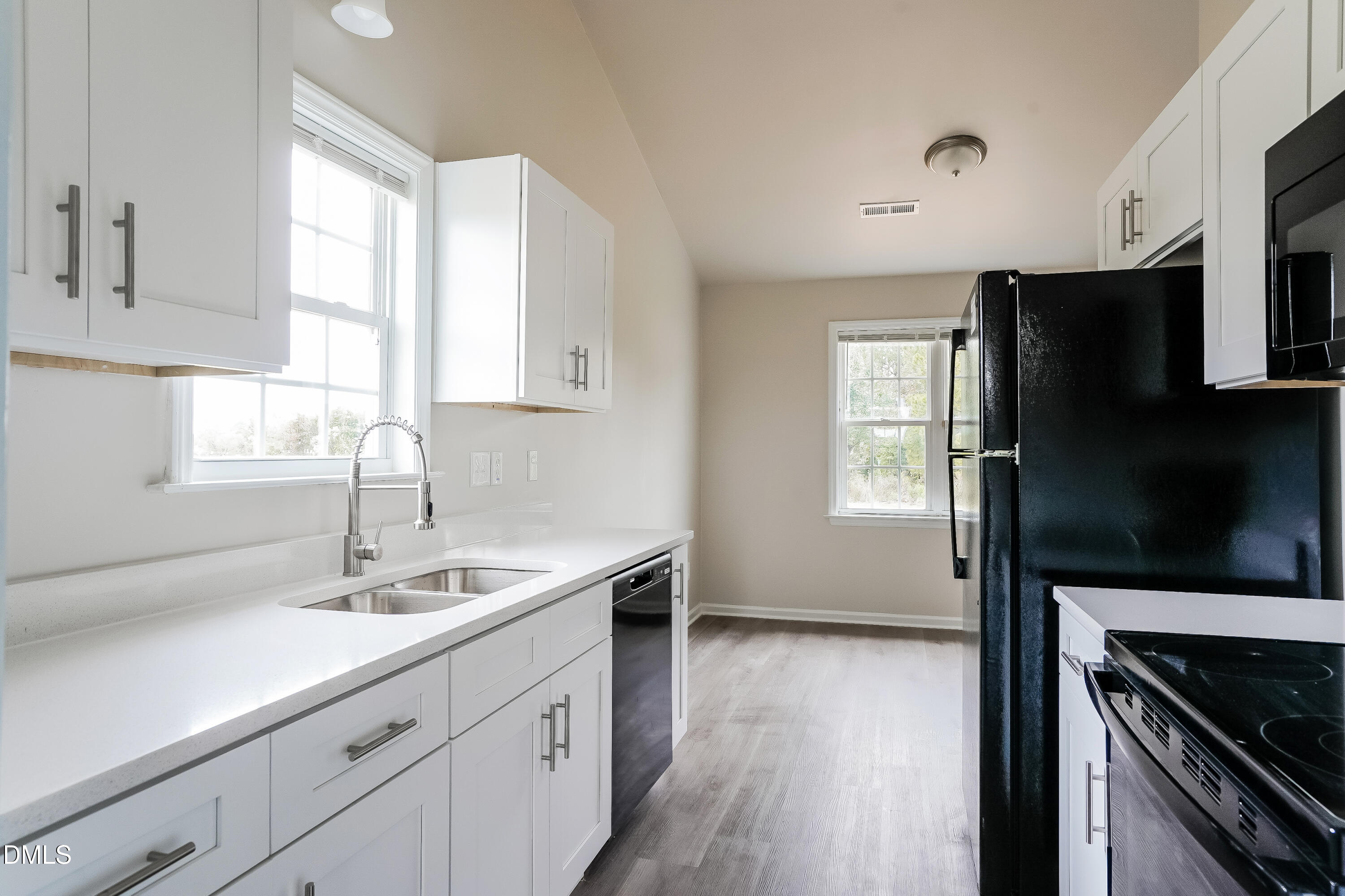 99 Jethro Circle Smithfield, NC 27577 - Photo 7 of 16 a kitchen with a sink stove and refrigerator