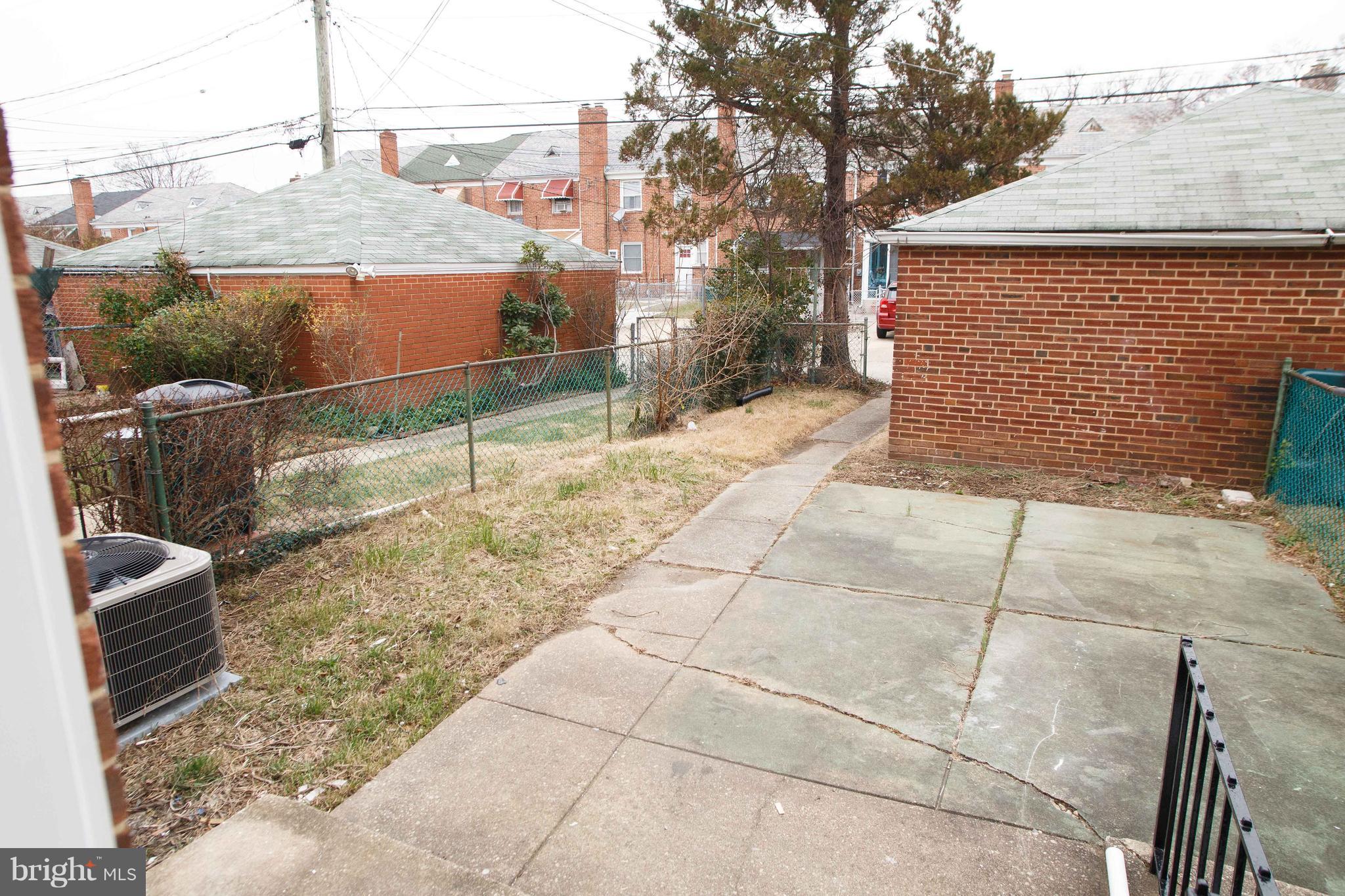 1550 Sheffield Road Baltimore, MD 21218 - Photo 31 of 34 Fenced Back Yard With Garage