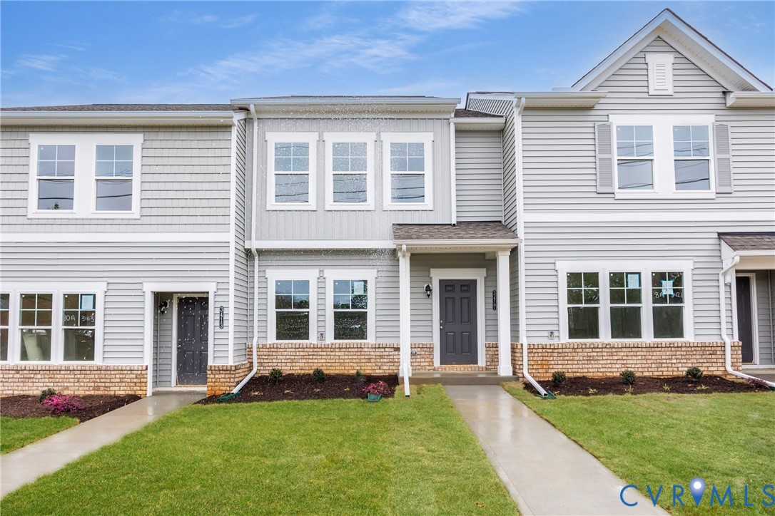 3437 Hopkins Road Richmond, VA 23234 - Photo 2 of 26 a front view of a house with a yard