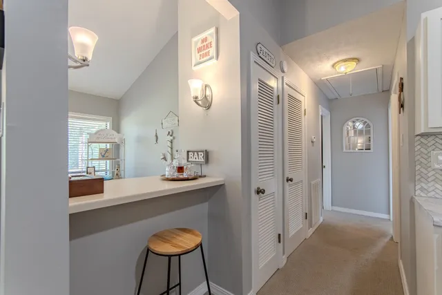 a dining room with furniture and chandelier