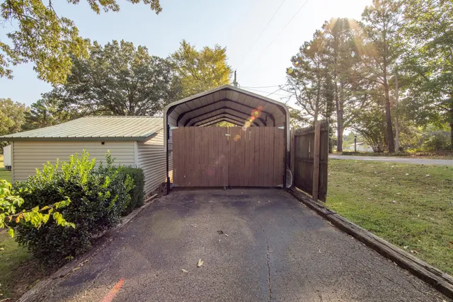 a view of a swimming pool with an outdoor space and seating area