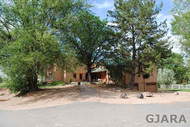 2561 I Road Grand Junction, CO 81505 - Photo 1 of 38 a view of road with trees