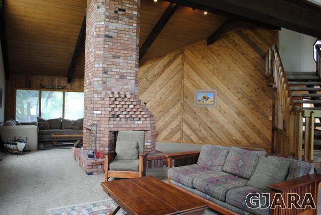 2561 I Road Grand Junction, CO 81505 - Photo 12 of 38 a outdoor living space with patio furniture and a fireplace