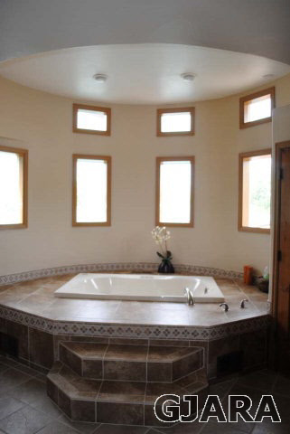 2561 I Road Grand Junction, CO 81505 - Photo 23 of 38 a bathroom with a sink and a mirror