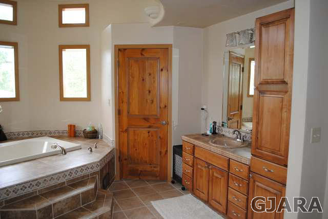 2561 I Road Grand Junction, CO 81505 - Photo 24 of 38 a bathroom with a sink double vanity