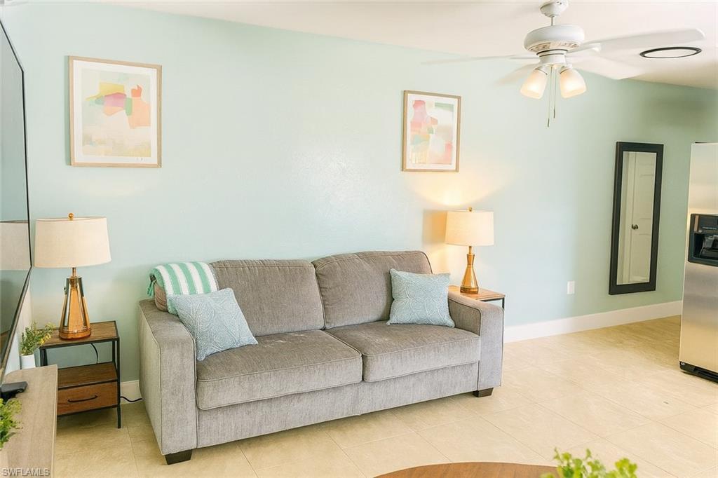 726 Park Avenue Naples, FL 34110 - Photo 12 of 32 a living room with furniture and a couch