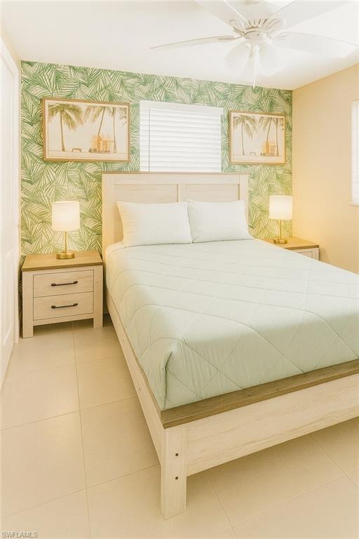 726 Park Avenue Naples, FL 34110 - Photo 13 of 32 a bathroom with a bathtub and a window