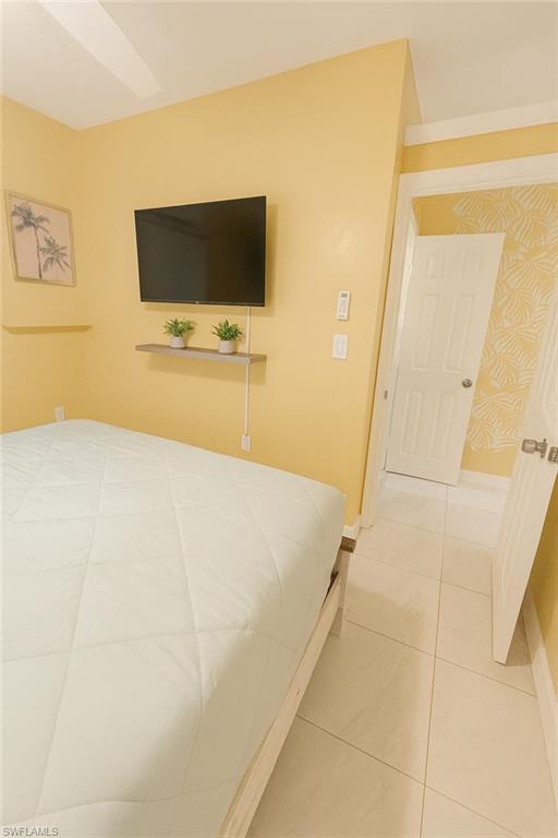 726 Park Avenue Naples, FL 34110 - Photo 14 of 32 a living room with a flat screen tv