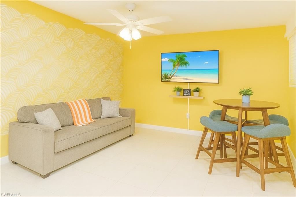 726 Park Avenue Naples, FL 34110 - Photo 17 of 32 a living room with a couch and a coffee table