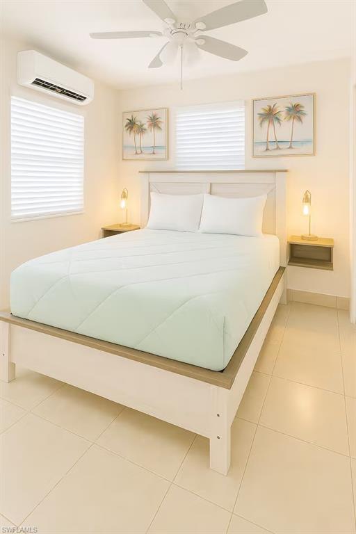 726 Park Avenue Naples, FL 34110 - Photo 23 of 32 a bedroom with a bed and a painting on the wall