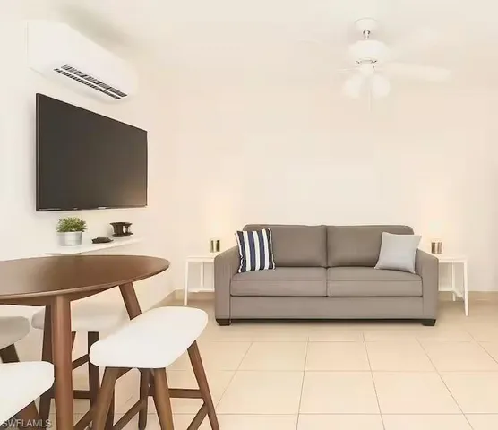 a kitchen with stainless steel appliances granite countertop a refrigerator and a stove