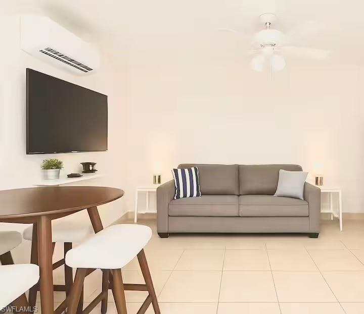 726 Park Avenue Naples, FL 34110 - Photo 24 of 32 a living room with furniture and a flat screen tv