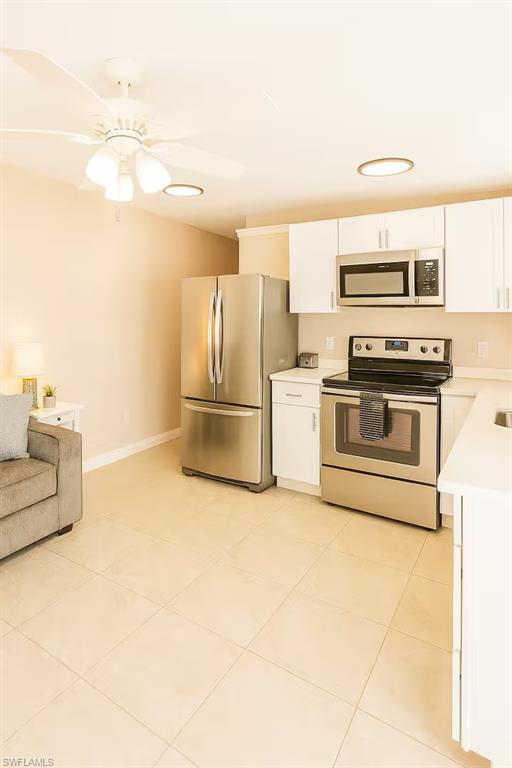 726 Park Avenue Naples, FL 34110 - Photo 25 of 32 a kitchen with stainless steel appliances granite countertop a refrigerator and a stove