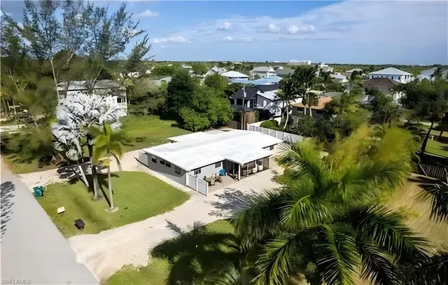 an aerial view of residential house with outdoor space and lake view