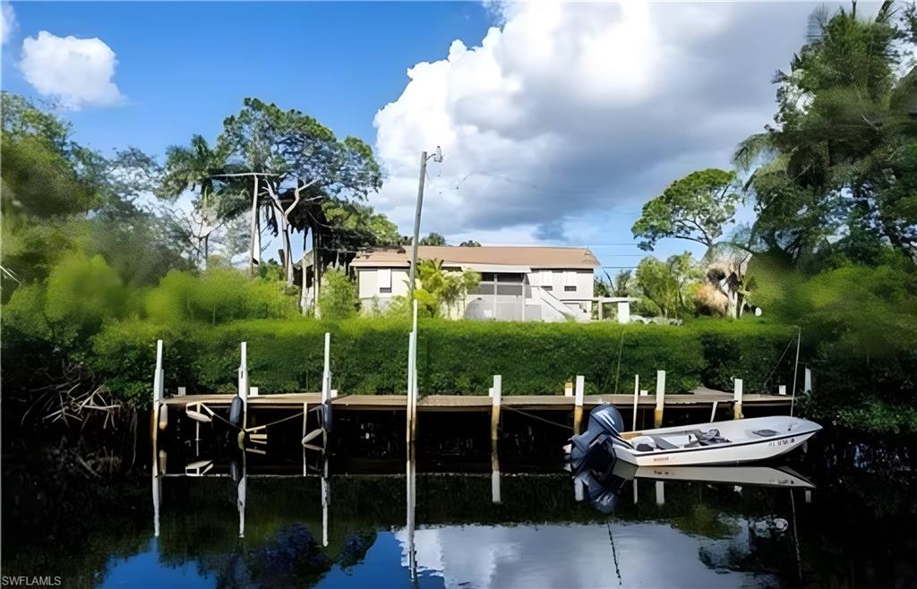 726 Park Avenue Naples, FL 34110 - Photo 30 of 32 a view of a chairs and table in backyard