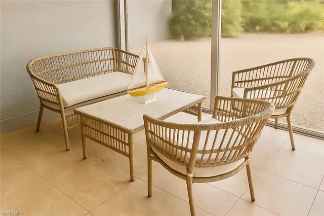 a view of balcony with wooden furniture