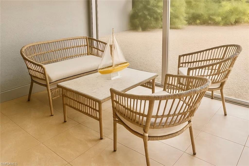 726 Park Avenue Naples, FL 34110 - Photo 7 of 32 a view of balcony with wooden furniture