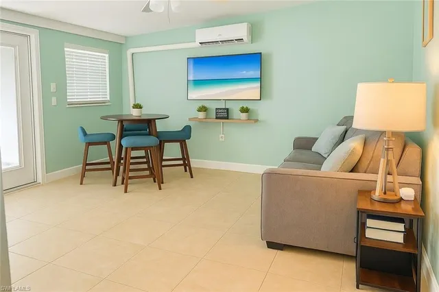 a living room with furniture and a window