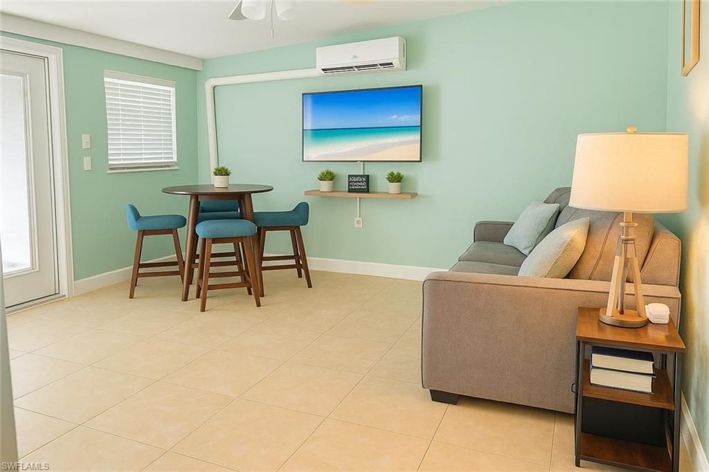 726 Park Avenue Naples, FL 34110 - Photo 10 of 32 a living room with furniture and a window