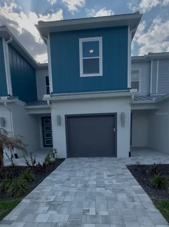 a front view of a house with yard