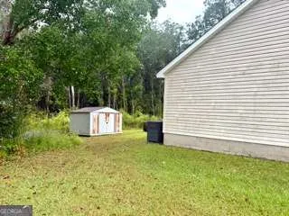 a view of a back yard of the house