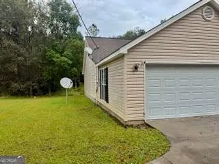 a view of a backyard with a garden
