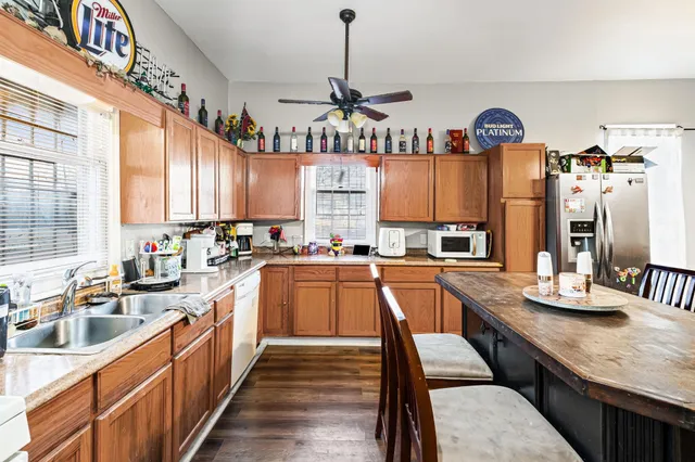 a kitchen with granite countertop lots of counter top space and dining table