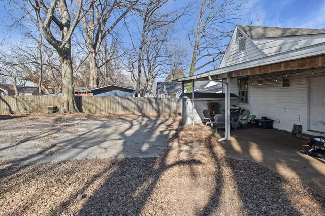 a view of a yard with trees