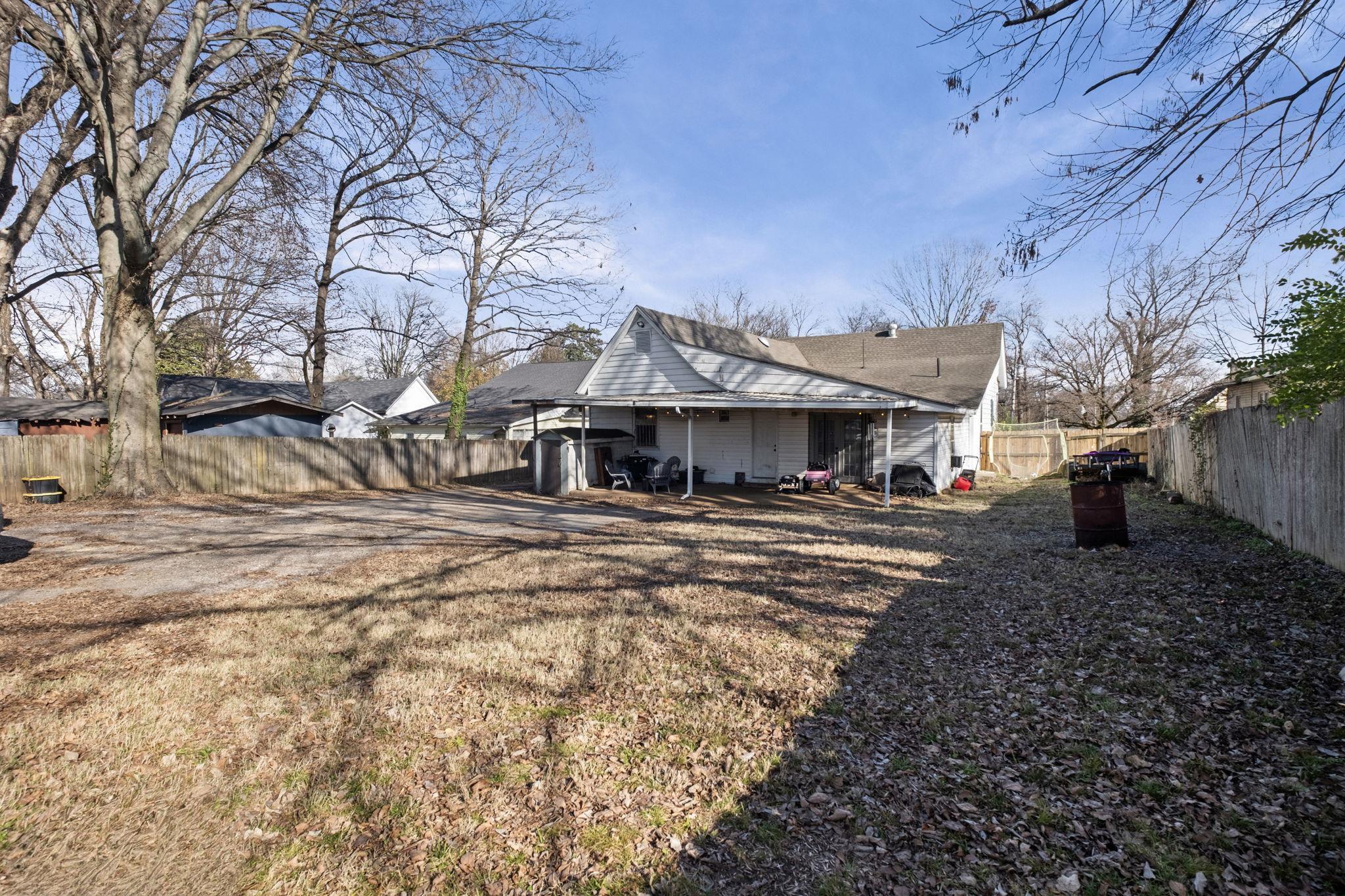 301 North Maple Street Covington, TN 38019 - Photo 25 of 26 a front view of a house with a yard
