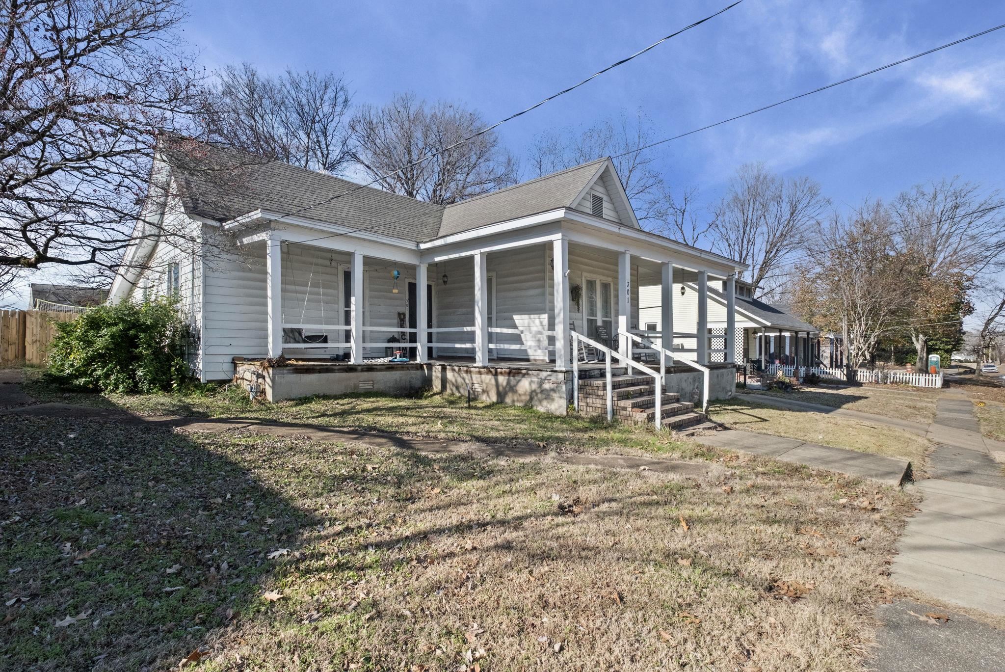 301 North Maple Street Covington, TN 38019 - Photo 3 of 26 a view of a house with a yard