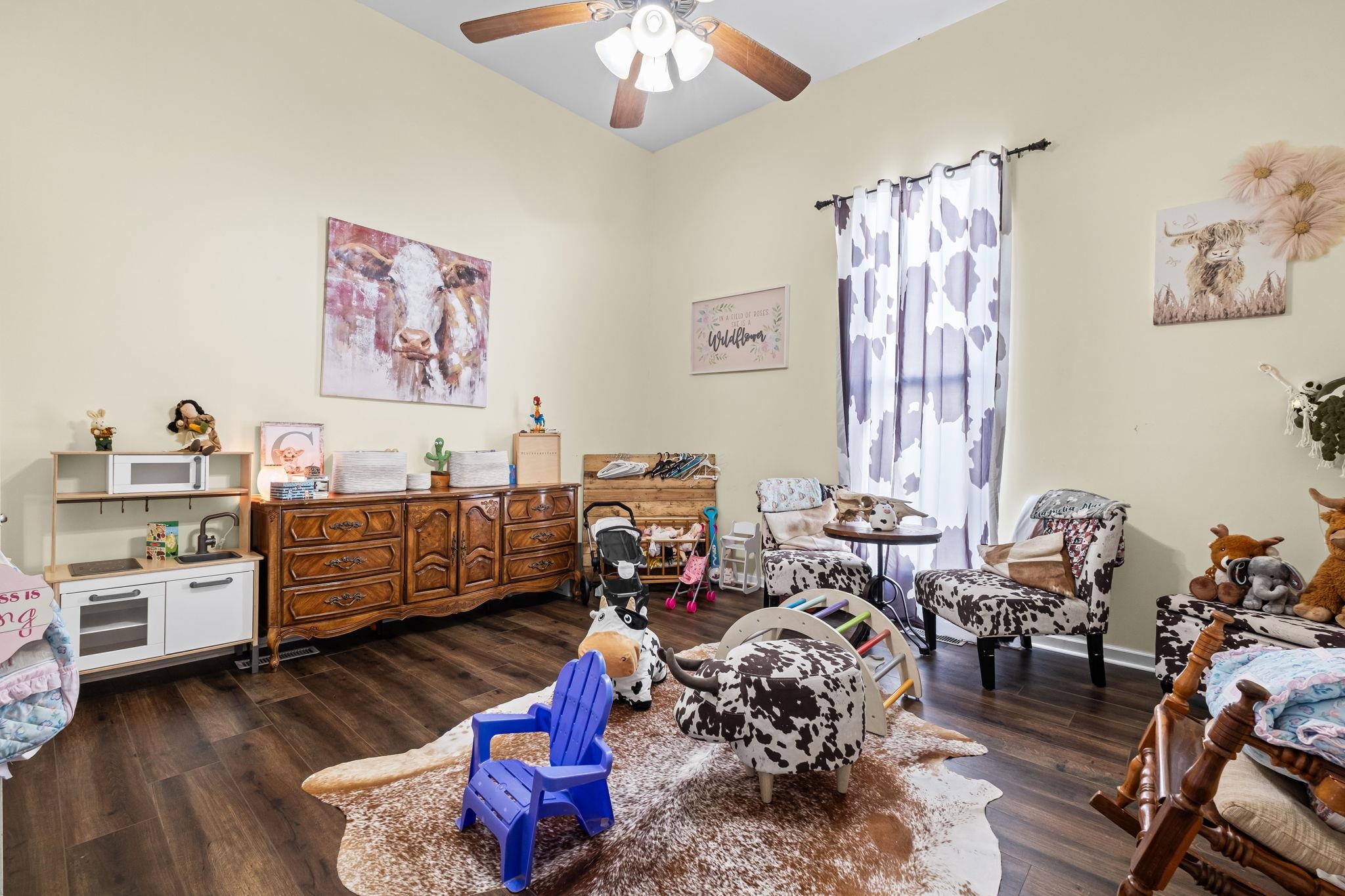 301 North Maple Street Covington, TN 38019 - Photo 6 of 26 a bed room with furniture and a window