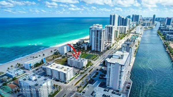 1901 South Ocean Drive, Unit 202 Hollywood, FL 33019 - Photo 2 of 11 a view of an ocean with a table and chairs