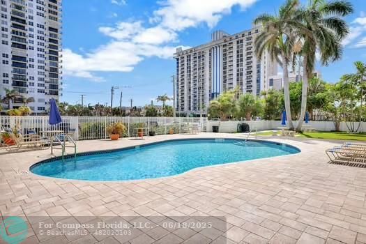 1901 South Ocean Drive, Unit 202 Hollywood, FL 33019 - Photo 4 of 11 a view of swimming pool outdoor seating and city view