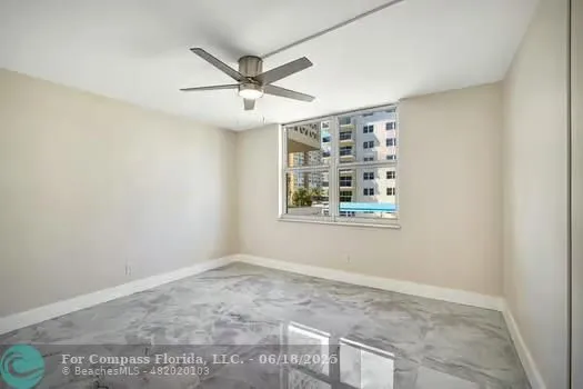 an empty room with fan