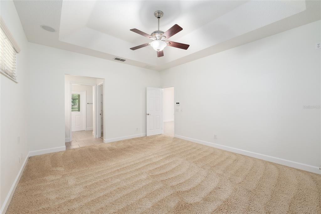 4735 Southeast 112th Street Road Belleview, FL 34420 - Photo 32 of 73 a view of an empty room with a ceiling fan