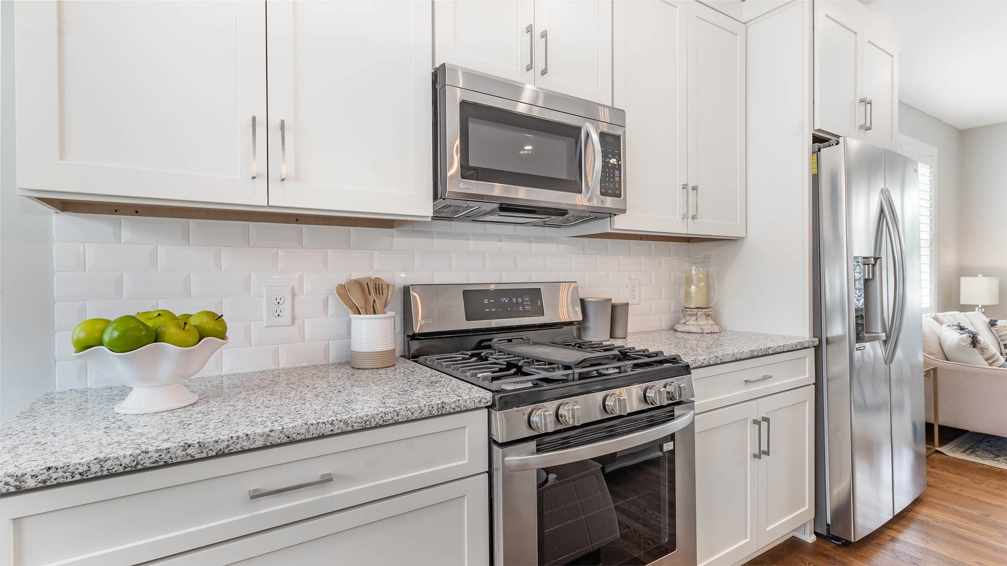 1153 Carter Street Franklin, TN 37064 - Photo 11 of 24 a kitchen with stainless steel appliances granite countertop white cabinets a stove a sink and a granite counter tops
