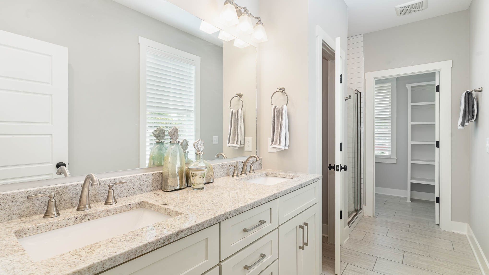 1153 Carter Street Franklin, TN 37064 - Photo 8 of 24 a bathroom with double vanity sinks and a mirror